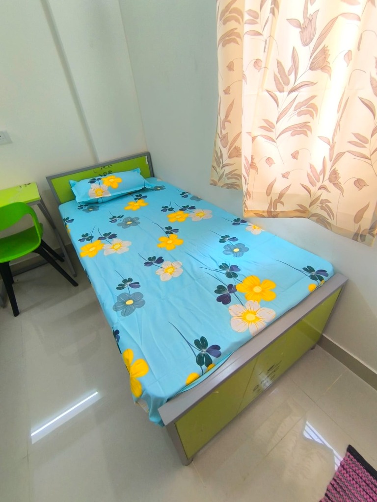 Vennela PG Sharing Room with Study Desk and Curtains